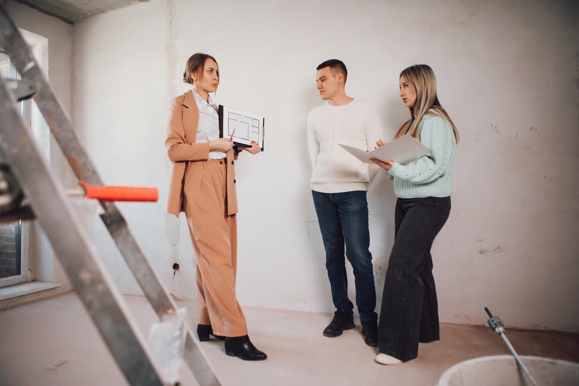 design-team-reviews-plans-at-construction-site-2026-01-05-23-18-52-utc